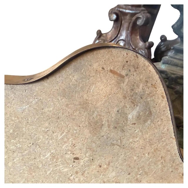 An exceptional and highly sought-after mid-century modern shield-shaped wall mirror designed in the distinct style of Gio...