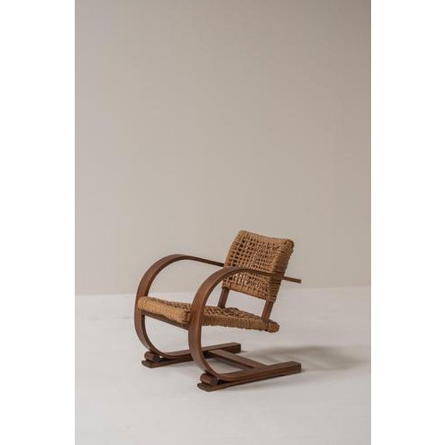 A beautiful example of the work of Audoux & Minet, this 1950s rope chair combines rustic craftsmanship with a refined,...