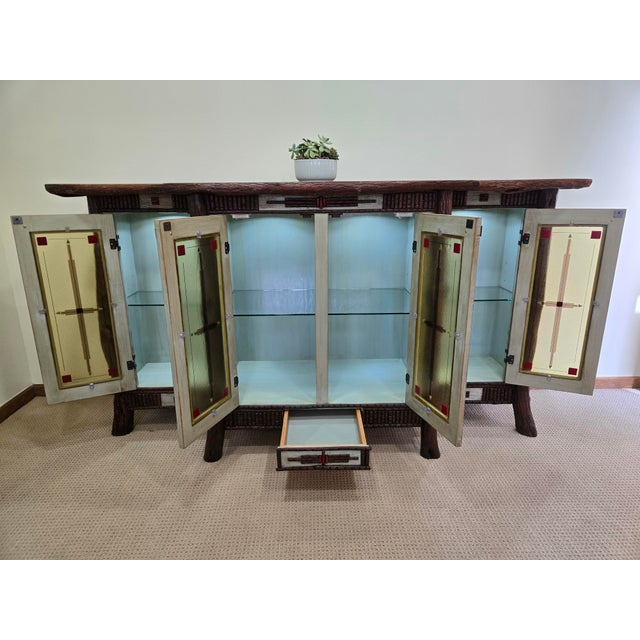 Exceptional, one-of-a-kind piece of Western studio art Furniture. This is a reclaimed distressed oak breakfront titled...