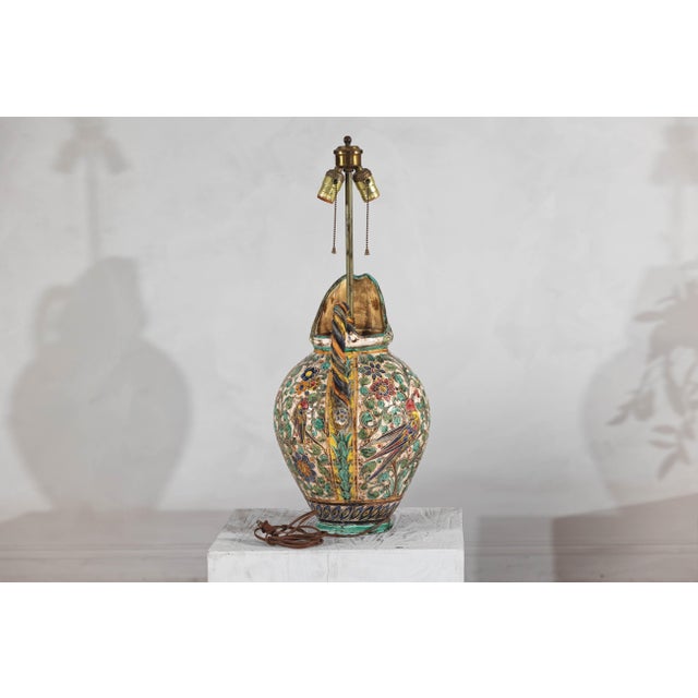 A Majolica inspired ceramic jug table lamp, wired for the USA. Infuse your space with vibrant color and timeless artistry...