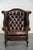 This Chesterfield wing armchair is made of English-style cowhide leather and has a charming appearance. The armchair...