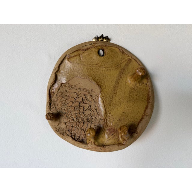 Unique vintage handmade studio pottery wall sculpture featuring an abstract organic design with earthy natural glazes and...