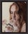 This oil on panel artwork features a contemplative figure gently holding a bouquet of soft pink roses, creating an...