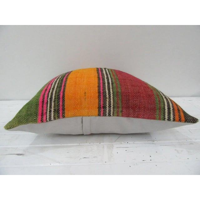 This is a pillow cover made from a vintage kilim rug. The piece was properly washed and ready to use. Pillow inserts not...