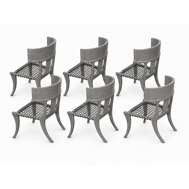 Robsjohn Gibbings style Klismos dining chairs. The chairs are in flawless condition. Grey ceruse finish. Leather cording...