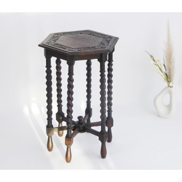 A beautiful antique wooden side table with twisted legs dating back to the beginning of the 20th century. The accent table...