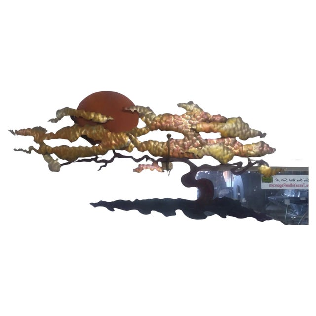 This is a nice sculpture by Bijan. It's made of copper and different metals. It's a hand crafted work of art depicting an...