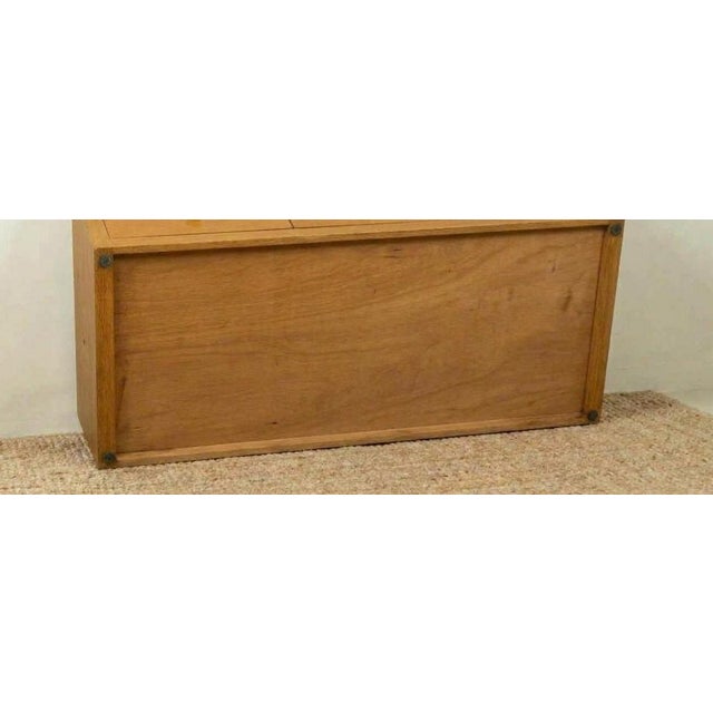 This beautiful light wooden platform bed features a sleek, minimalist design that sits low to the ground, keeping...