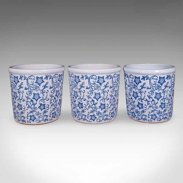 This is a trio of vintage tree planters. A Portuguese, ceramic jardiniere with blue & white pattern, dating to the late...