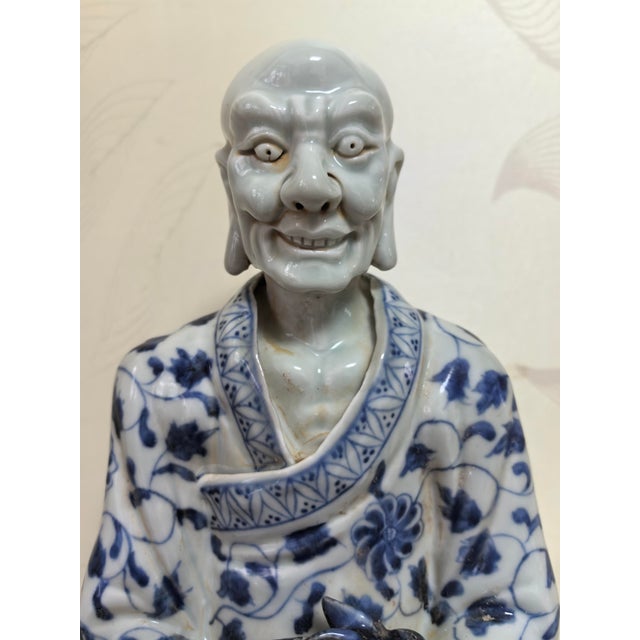 W-19cm,H-32cm This hand-carved blue and white porcelain statue depicts The Eighteen Arhats, a traditional Chinese Buddhist...