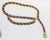 Chanel chain link belt with leather woven through the links. Closes by hook to link a wrap over the hip or across the...