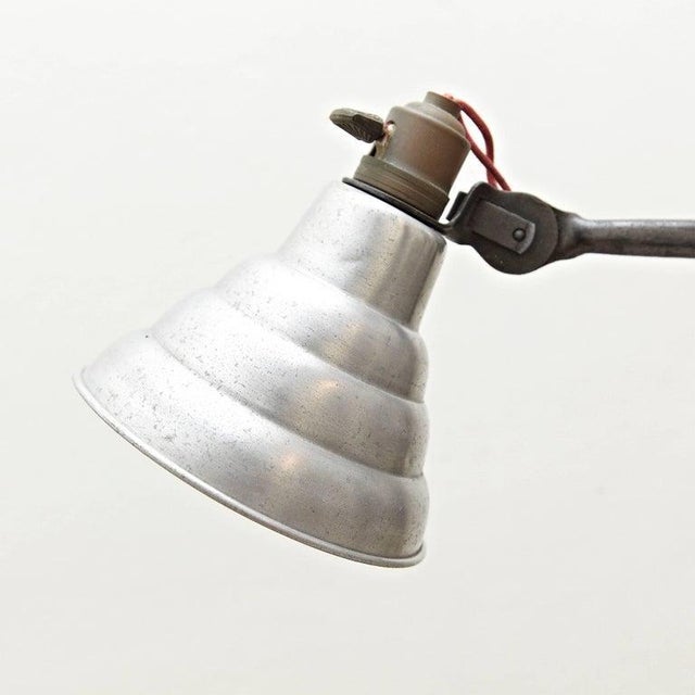Table lamp designed by Bernard-Albin Gras. Manufactured by Gras, (France), circa 1930. Aluminium and steel. In good...