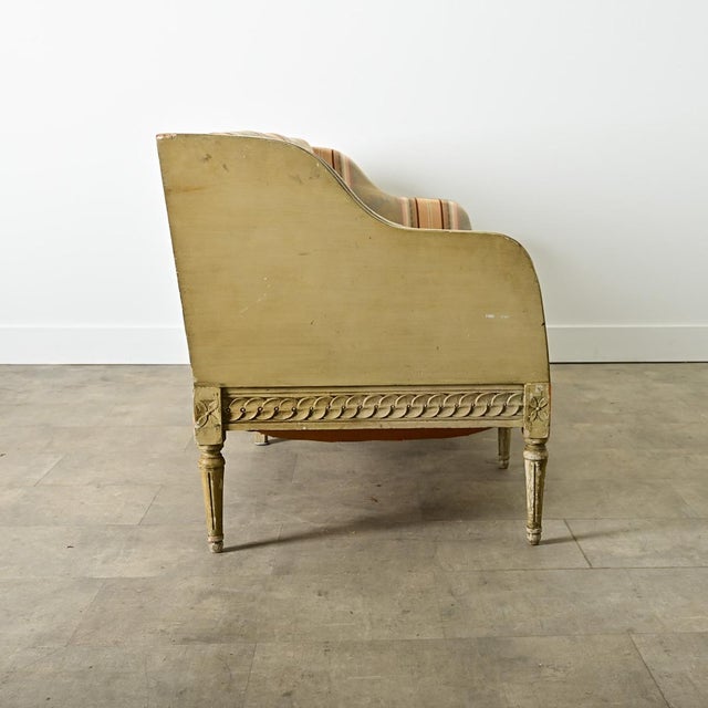 Dimensions: 32 ¼” H x 74 ⅛” W x 30 ½” D A unique Swedish Gustavian settee from the late 18th century with painted wood...