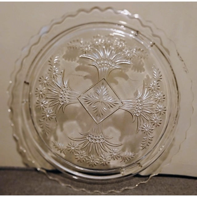 This is a Indiana glass company " daisy daine" pattern cake platter. This is Crystal and was made around 1933 and was the...