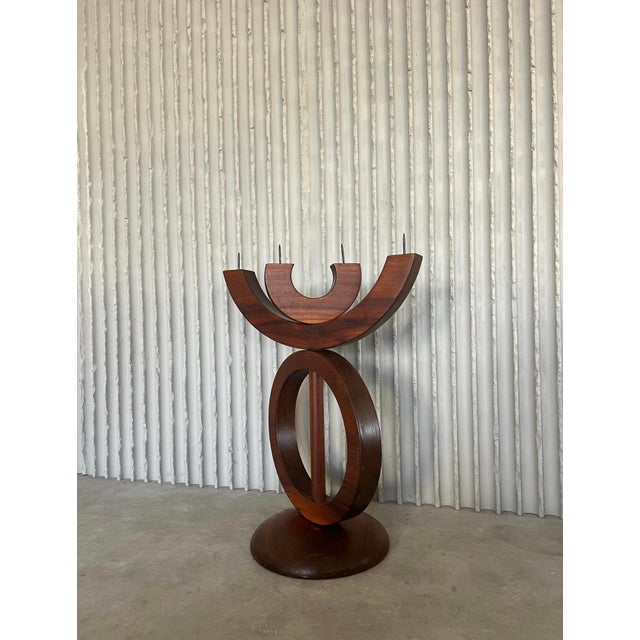 A striking sculptural candle holder from a Dutch church, dating back to the 1960s. Crafted entirely from solid rosewood,...