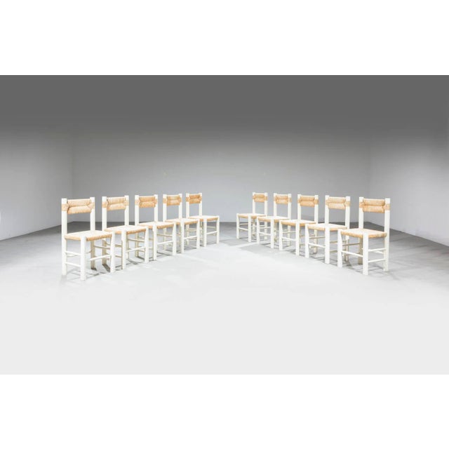 Ten chairs Lacquered wood structure, seat and backrest in woven straw. 1960s cm 86x42x42