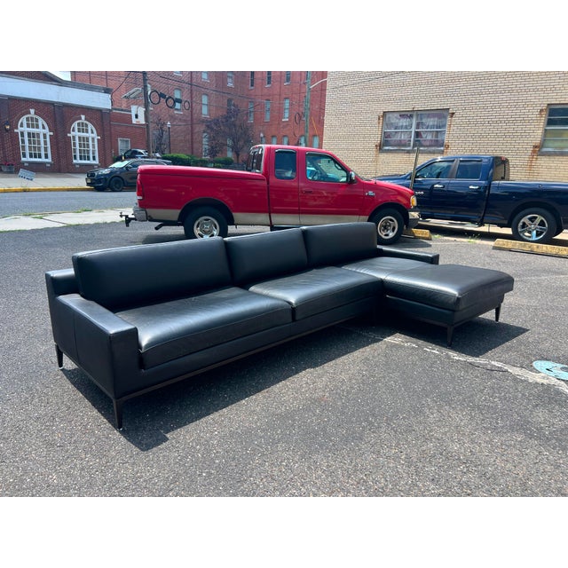 Authentic RH (Restoration Hardware) Italia Track Arm leather sectional featuring a streamlined, low-profile silhouette...