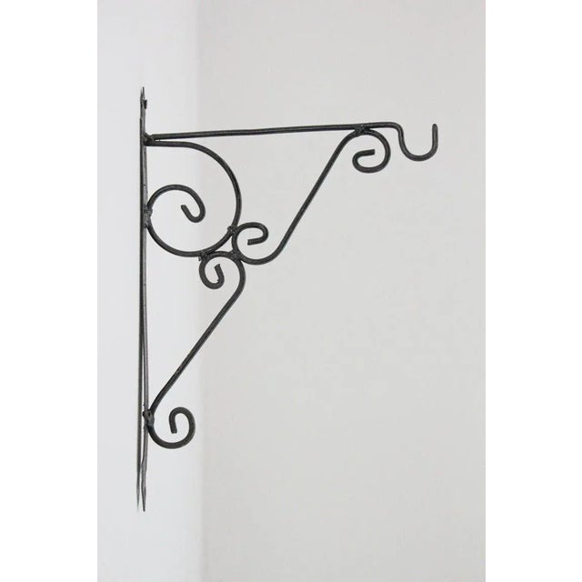 Hand crafted iron scroll design wall bracket.Vintage wrought iron handcrafted wall-bracket for lanterns or signs.Perfect...