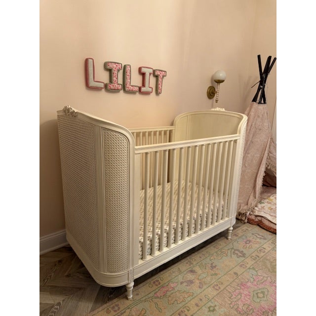 Gorgeous Cane Panel Crib with Floral detail from RH Kids with unopened in box toddler conversion kit so you will get many...