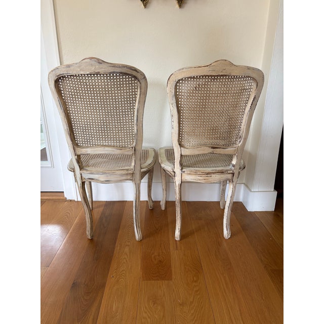 True French Elegance - this pair of 1940s Louis XV Style Caned back and seat accent chairs are both well constructed and...
