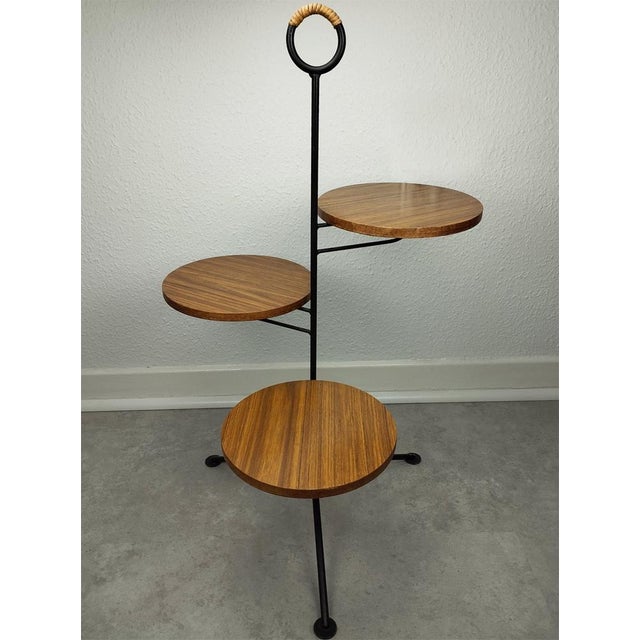 The rare and elegant plant stand from the German manufacturer Ilse Möbel has a minimalist but very stable, 82 cm high...