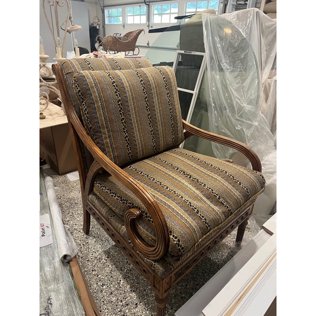 Swaim chair purchased in the early 2000s with interesting carved details and comfortable cushioned seat. Excellent...