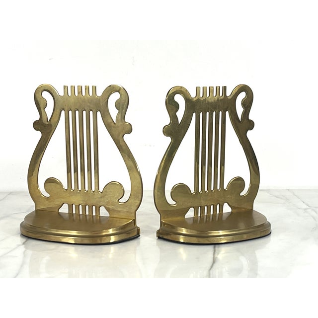 Pair of vintage brass musical harp bookends. Made in Taiwan R.O.C. Makers mark on bottom. Minor age wear.