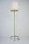 An elegant floor lamp originating from italy, circa 1960. This piece features a heavy, solid brass construction...