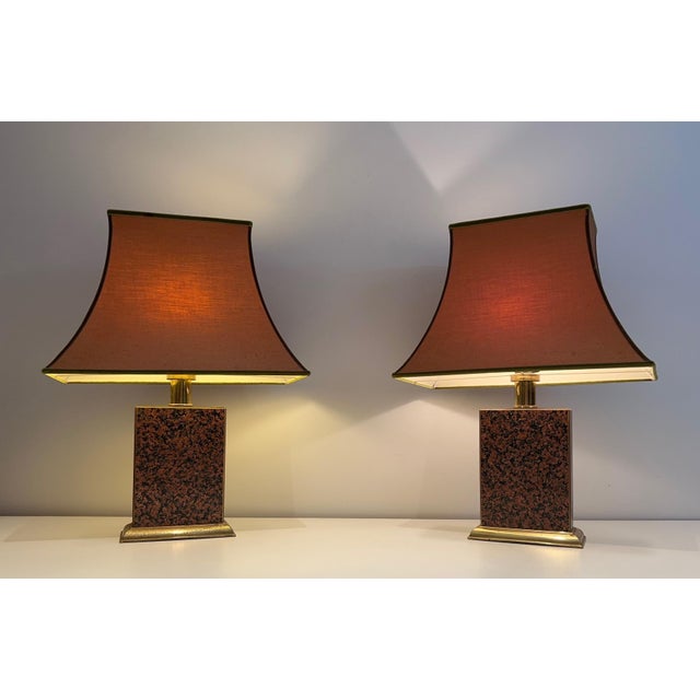 This beautiful pair of Chinese-style lamps is made of printed wood and gilt metal with pagoda-shaped shades. This is a...