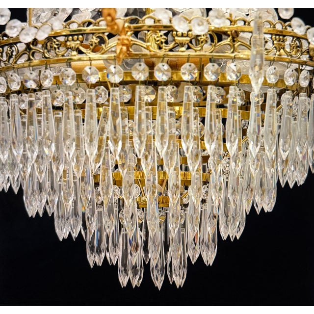 A crystal chandelier for six candles. The frame is made of brass and is of excellent quality and craftsmanship. Decorated...