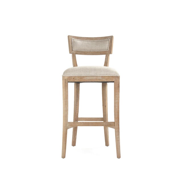 The Carvell Bar Stool from Zentique brings the collection's klismos-inspired silhouette to bar height. The concave back...