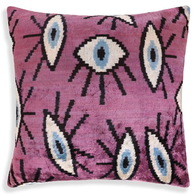 "Size: 20x20 inches Handmade from 100% silk velvet, vegetable-dyed with natural pigments Features an eye-inspired Ikat...