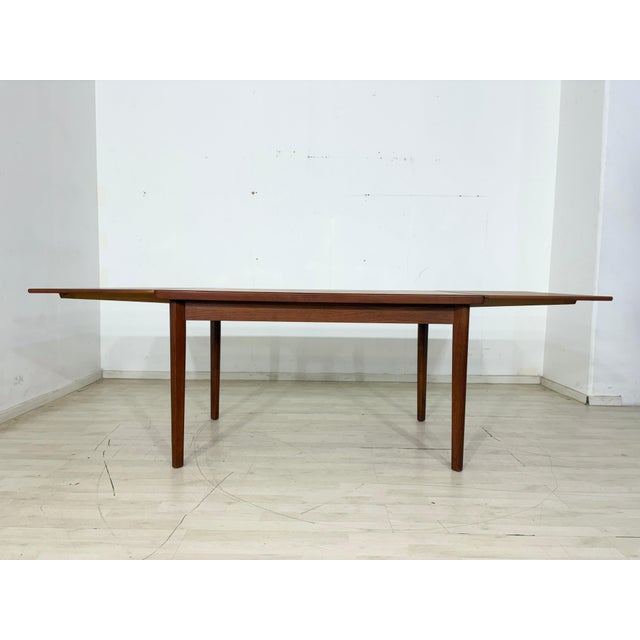 For sale is this beautiful, extendable dining table made of high-quality teak. The table impresses with its timeless...