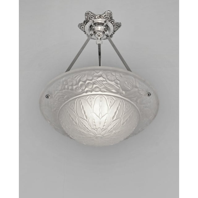 HUBERT PETITOT A nice French 1925-1930 art deco chandelier in nickel plated solid brass or bronze by Hubert Petitot...