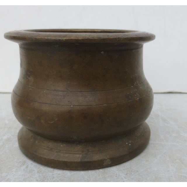 Antique bronze mortar, slight iron content, slight magnetic reactions. Natural deep brown patina with thick, heavy walls....