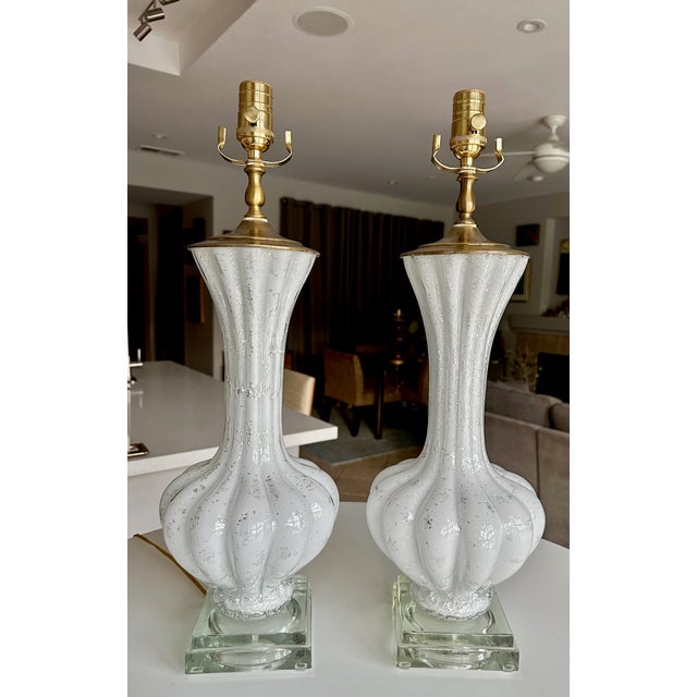 Pair of Murano Italian hand blown white glass table lamps with silver mica flecks throughout on custom molded glass bases...