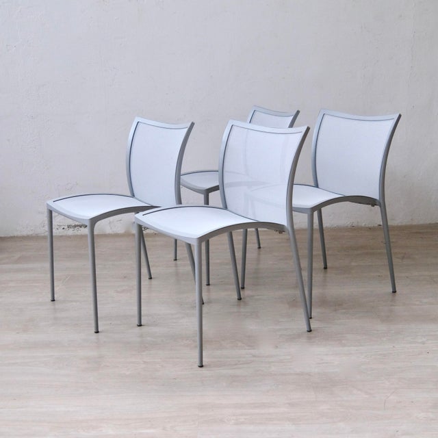 90s Zilli chairs by Zanotta, made in Italy. Modern and attractive design. The 4 chairs are stackable and have a painted...