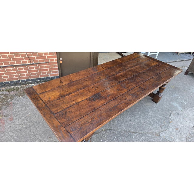 A superb 2 inch thick five plank farmhouse refrectory dining table in oak, peg jointd throughout, turned legs, in...