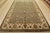 A traditional Agra rug is hand-knotted with fine wool on a cotton foundation. This area rug features a botanical design...