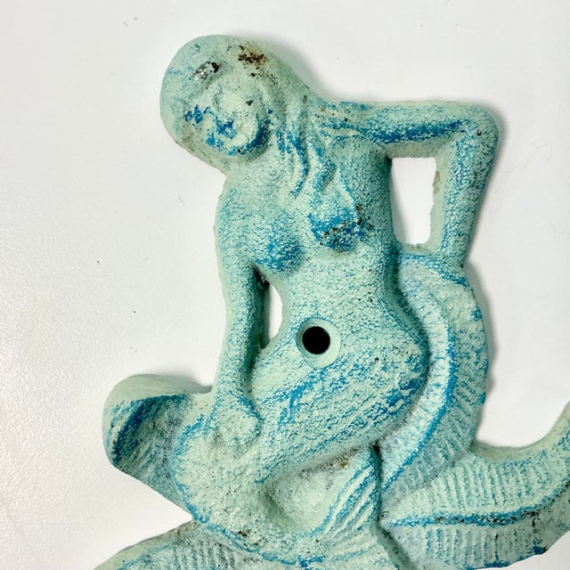 We couldn’t pick this fabulous Wall Hook up fast enough when we saw it. The cast iron item is a Mermaid sitting on a...
