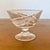 A striking mid-century crystal ensemble by Cristallerie de Lorraine, composed of eight coupe glasses encircling a...