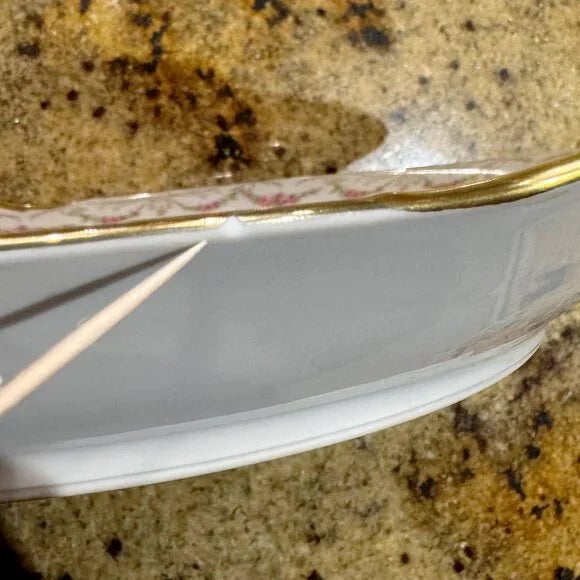 Elite Limoges Porcelain Platter. Has wear and a small chip as pictured. Measures 13.5 inches across.