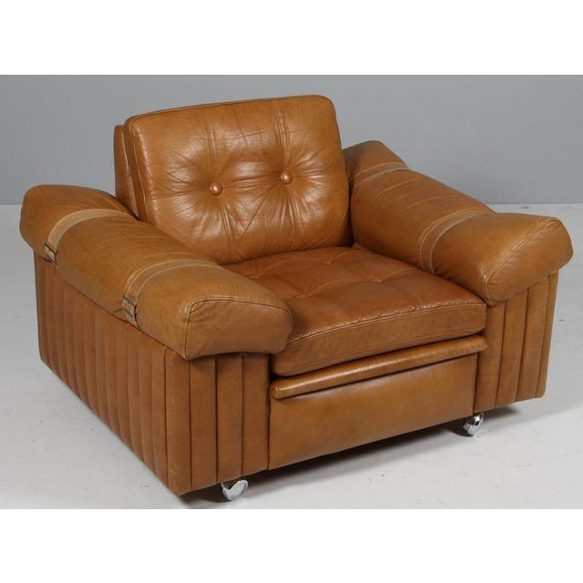 Danish furnituremaker lounge chair in brutalist style. Made in patinated leather. Based on wheels. Made in Denmark in the...