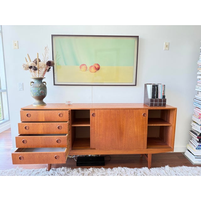 A generous and well-proportioned Swedish modern teak sideboard by AVIKKA, Sweden, circa 1960s. At 75" wide, this is a rare...