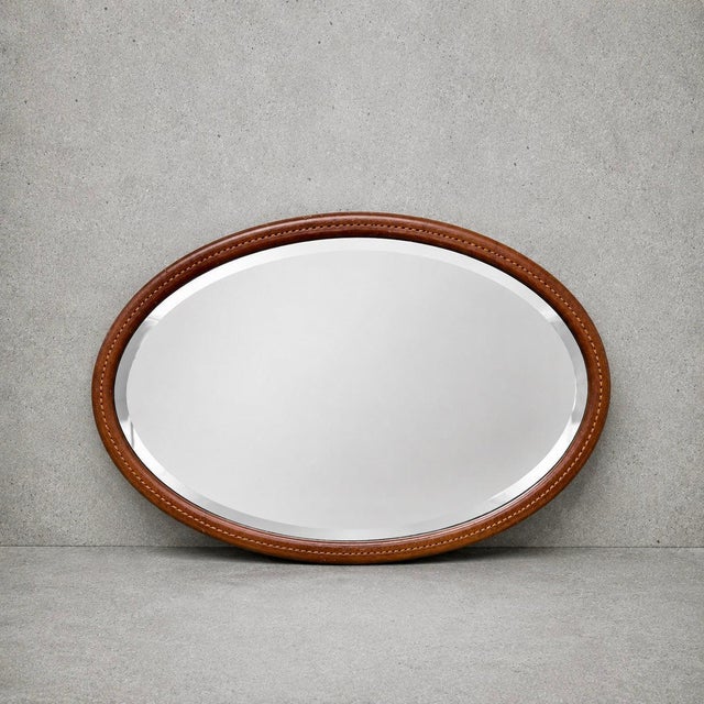 Details * Antique wall mirror * Solid mahogany frame * Oval form * Decorative satinwood string inlay * Original bevelled...