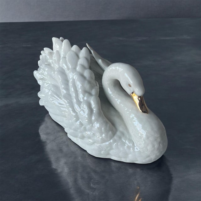 This elegant vintage Lenox porcelain swan figurine, titled The Graceful Swan, is a timeless symbol of beauty, devotion,...