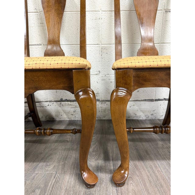 This is a stunning complete set of four vintage Ethan Allen Classic Manor splat back dining chairs 15-6001. Features a...