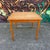 A classic Danish Modern teak dining table featuring a square top with two convenient pull-out leaves that extend from...
