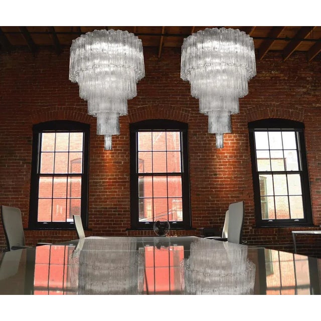 Pair of Italian vintage chandelier in Murano glass and nickel-plated metal structure on 5 levels. The armor polished...