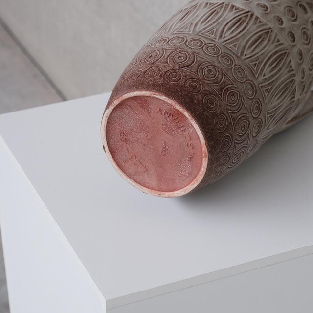 A mid to large sized ceramic vase. stamped to the base. mid to late 20th, germany. muted grey colour with hints of red...